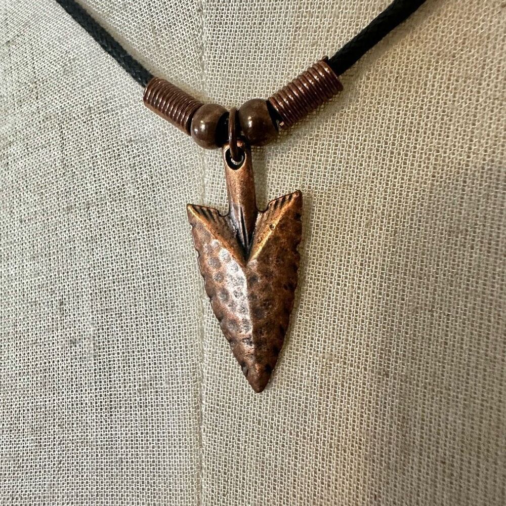 copper tone arrowhead pendant necklace on black cord